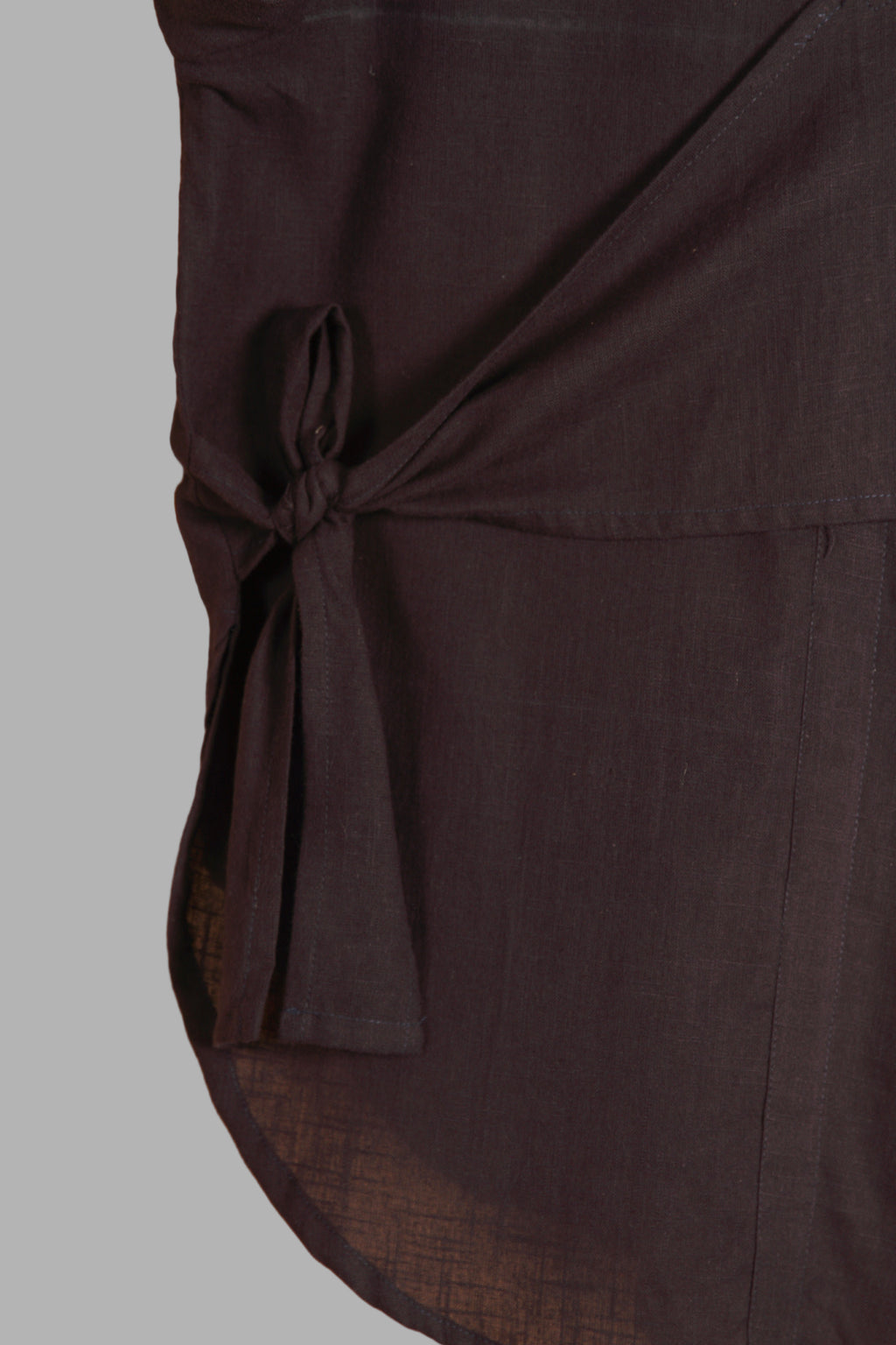 Close-up of a fullblank branded black long-sleeve shirt called MIDNIGHT MUSE-B with a plain background