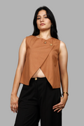 Woman wearing a fullblank branded brown sleeveless top called EIRA-A with a plain background