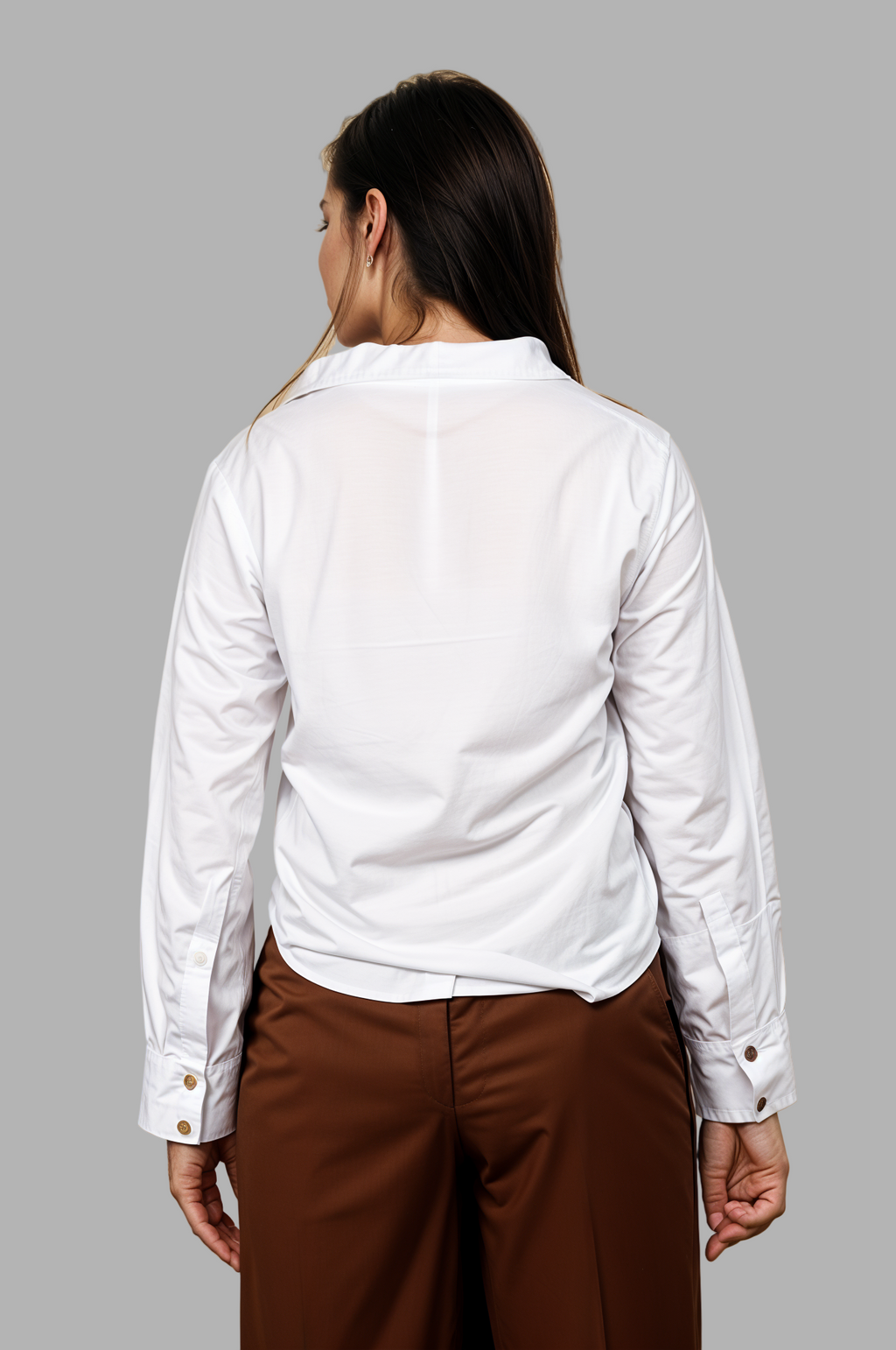 Woman wearing a fullblank branded white shirt called LAVI-A with a plain background