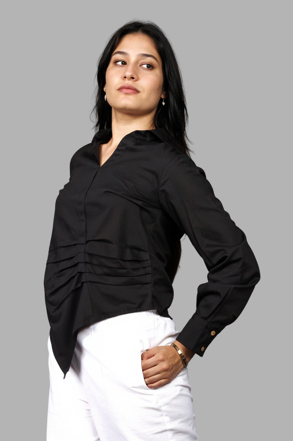 Woman wearing a fullblank branded black shirt called LAVI-B with a plain background