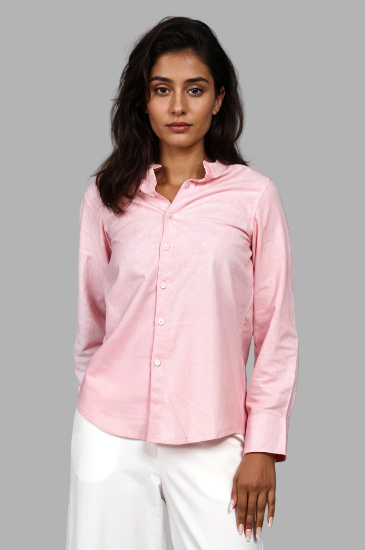 Woman wearing a fullblank branded pink full-sleeves shirt called ORA-A with a plain background