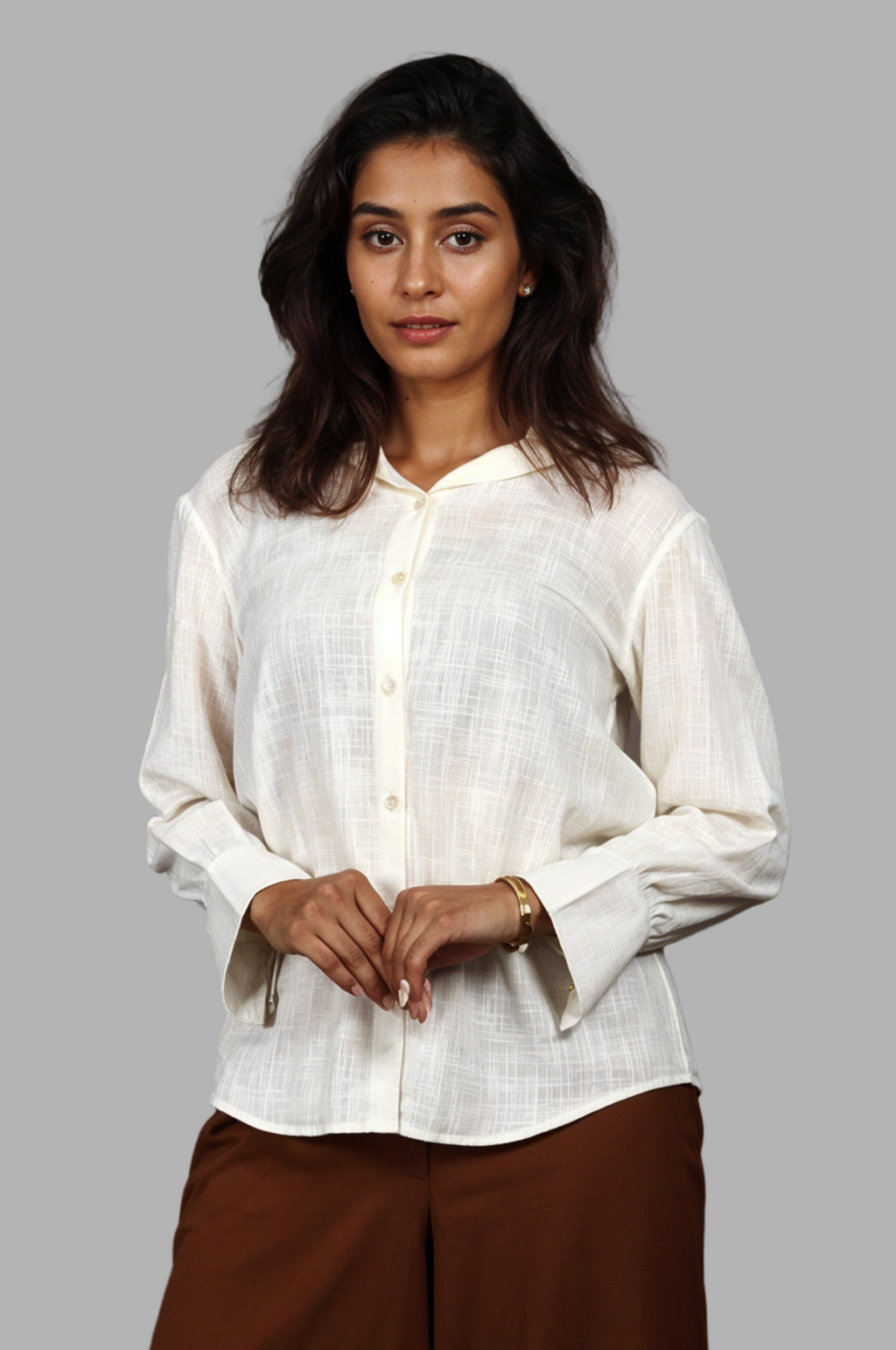 Woman wearing a fullblank branded light yellow shirt called PEARL-A with a plain background