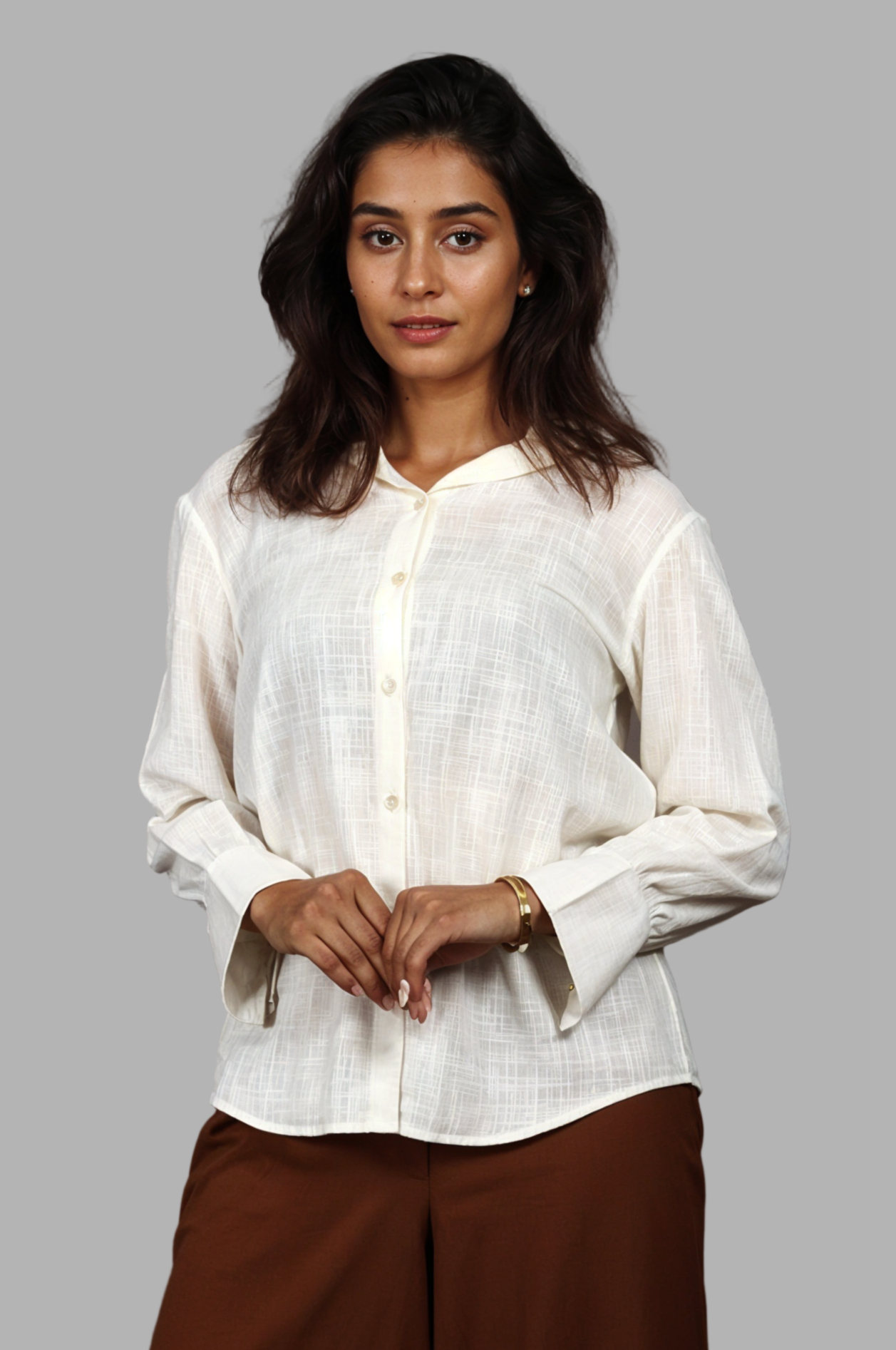 Woman wearing a fullblank branded light yellow shirt called PEARL-A with a plain background