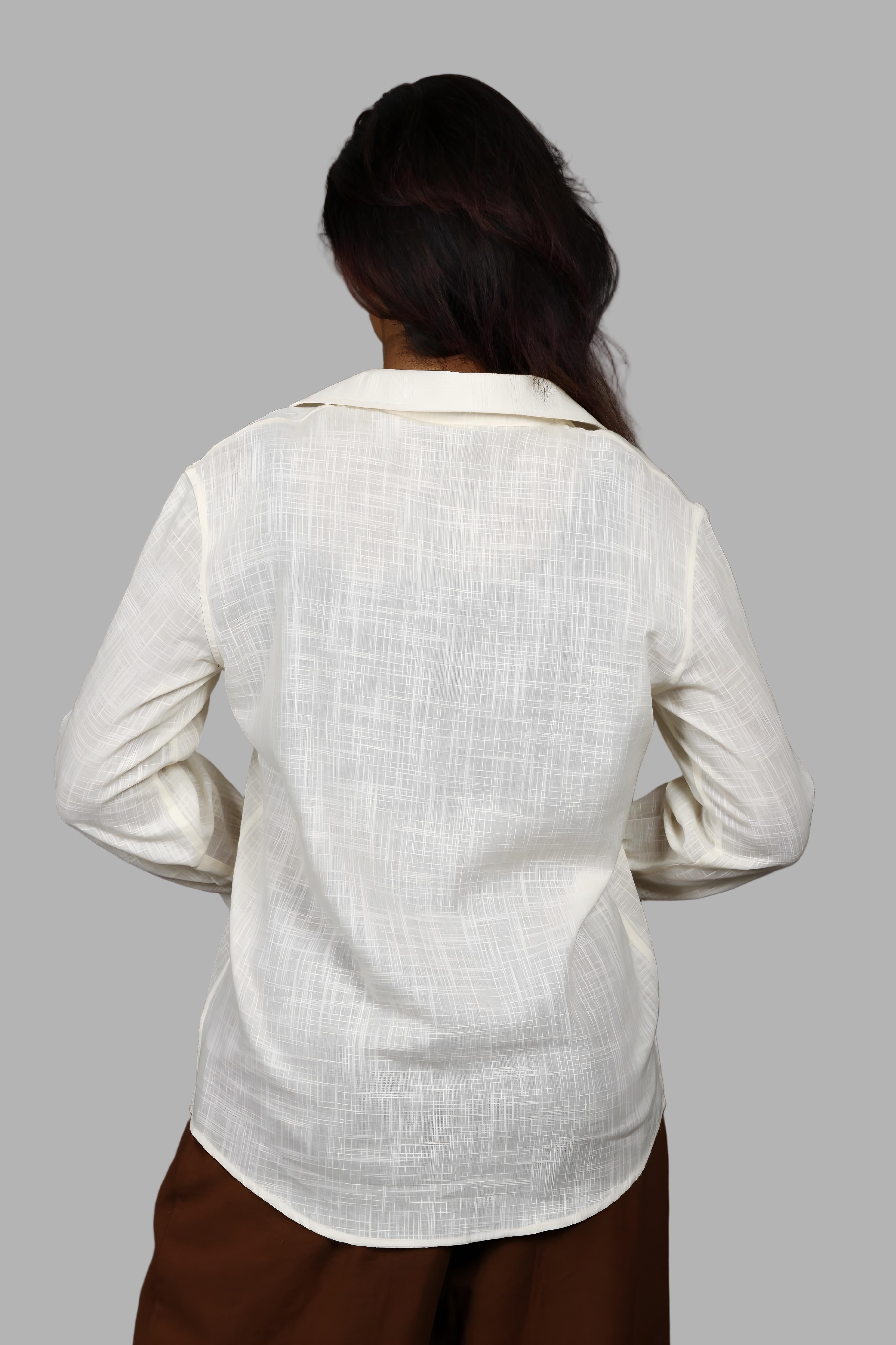 Woman wearing a fullblank branded light yellow shirt called PEARL-A with a plain background