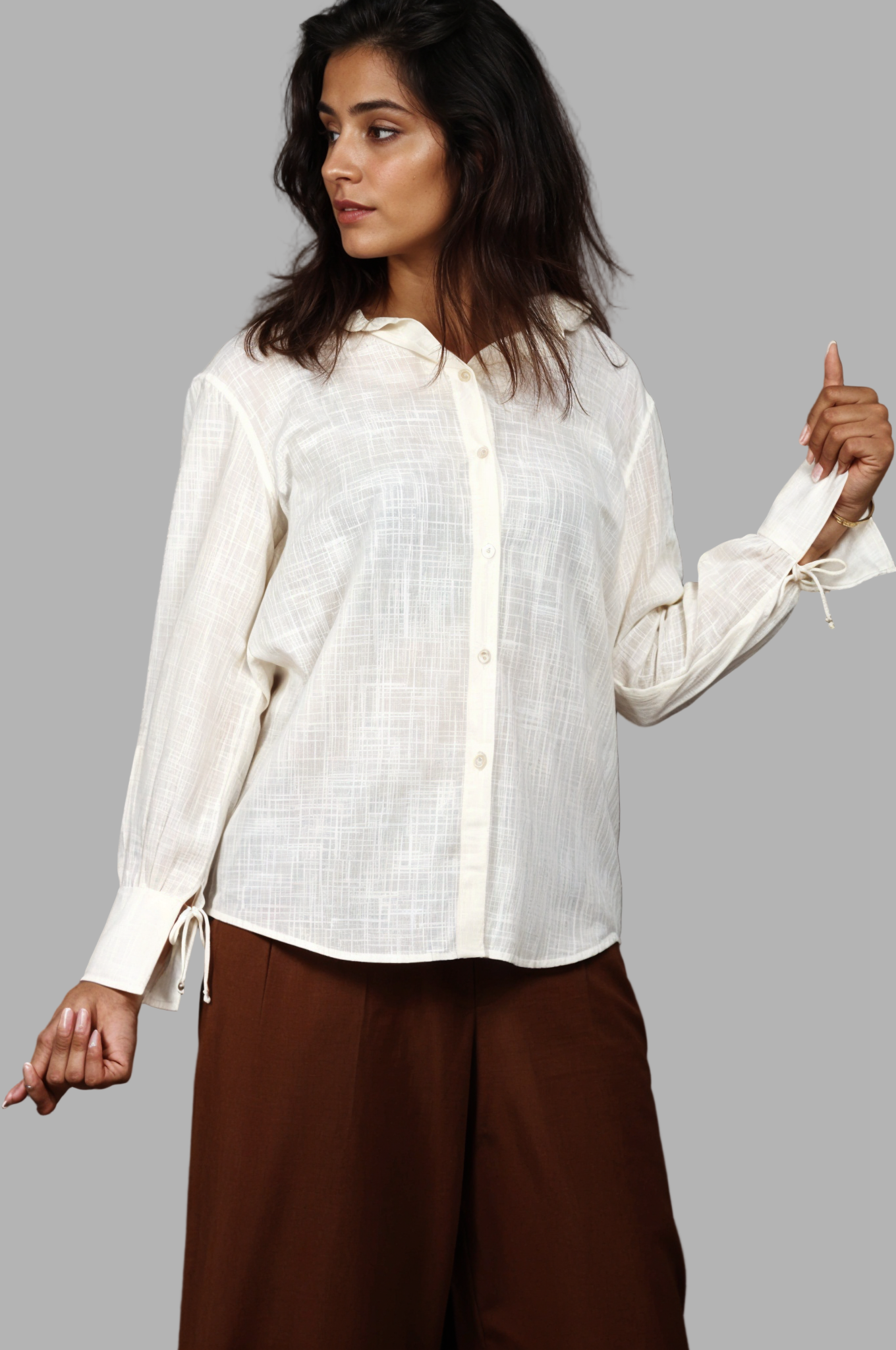 Woman wearing a fullblank branded light yellow shirt called PEARL-A with a plain background