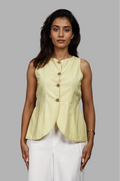 Woman wearing a fullblank branded pistachio vest called ZENA-B with a plain background